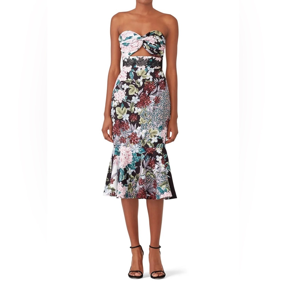 Pink floral strapless dress with flounce hem. Sweetheart neckline. Fully lined.